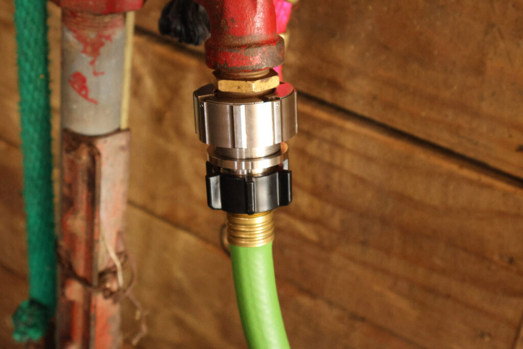 Clean installation of Hose Shark on heavy-duty metal outdoor spigots.