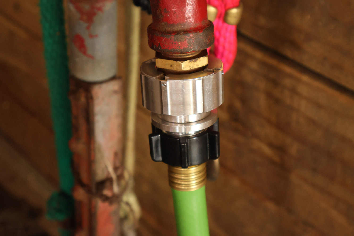 Hose Shark installed on metal outdoor faucet
