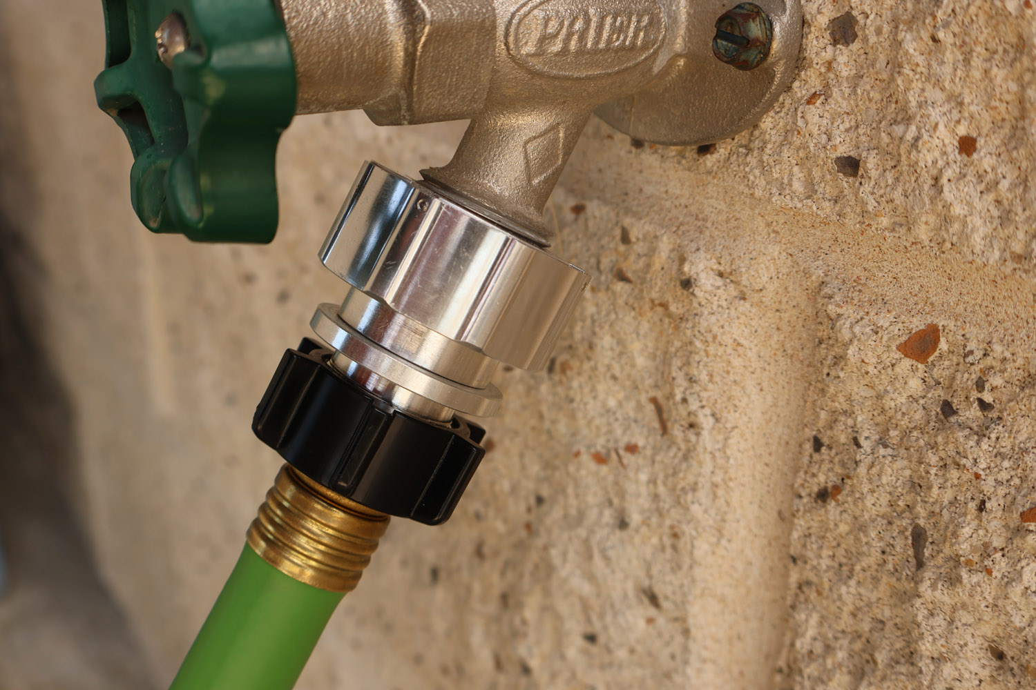 Hose Shark installed on aging outdoor faucet